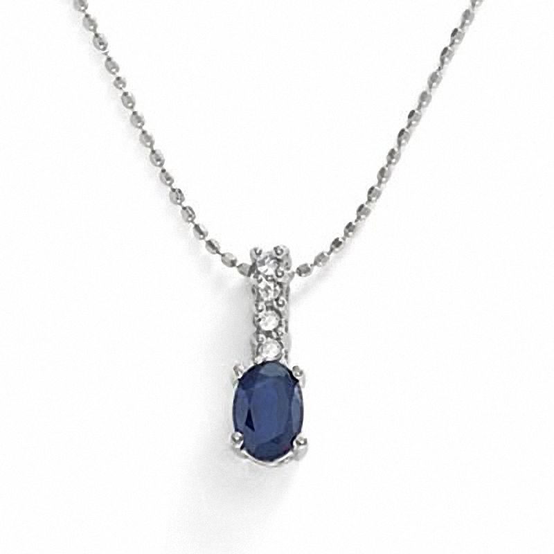 Oval Sapphire and Diamond Pendant in Platinum