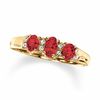 Thumbnail Image 0 of Oval Garnet Three Stone Ring in 10K Gold with Diamond Accents - Size 7
