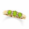 Thumbnail Image 0 of Oval Peridot Three Stone Ring in 10K Gold with Diamond Accents - Size 7
