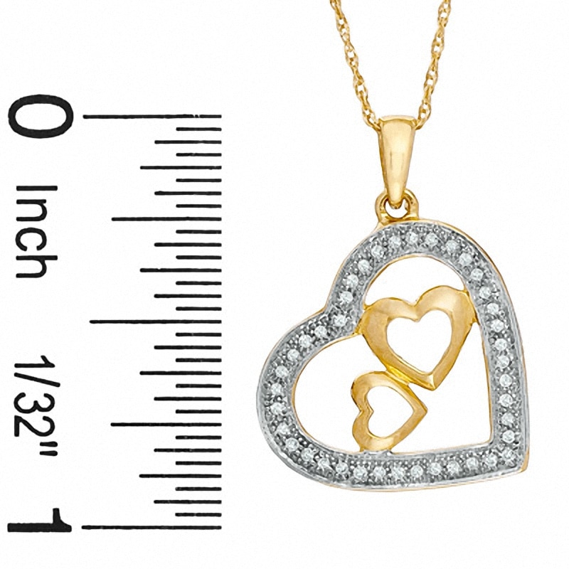 1/10 CT. T.W. Diamond Heart Pendant in 10K Gold - 16"