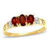 Thumbnail Image 0 of Oval Garnet Three Stone Ring in 10K Gold - Size 7