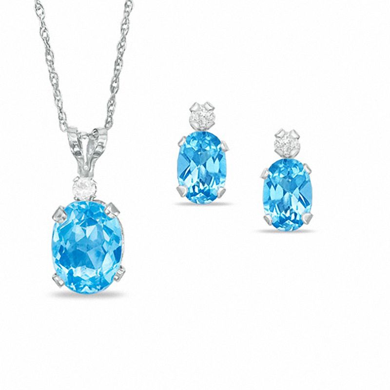 Oval Simulated Blue Topaz Pendant and Stud Earrings Set in Sterling Silver with CZ