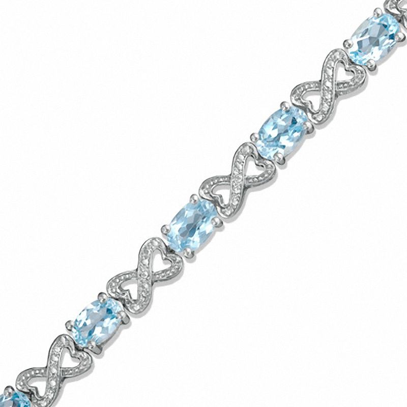 Oval Blue Topaz and Diamond Bracelet in Sterling Silver - 7.25"