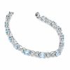 Thumbnail Image 1 of Oval Blue Topaz and Diamond Bracelet in Sterling Silver - 7.25"