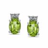 Thumbnail Image 0 of Oval Peridot and Diamond Accent Earrings in Sterling Silver