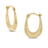 Thumbnail Image 0 of Diamond-Cut Oval Hoop Earrings in 10K Stamp Hollow Gold