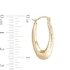 Thumbnail Image 1 of 10.3mm Diamond-Cut Hollow Oval Hoop Earrings in 10K Gold